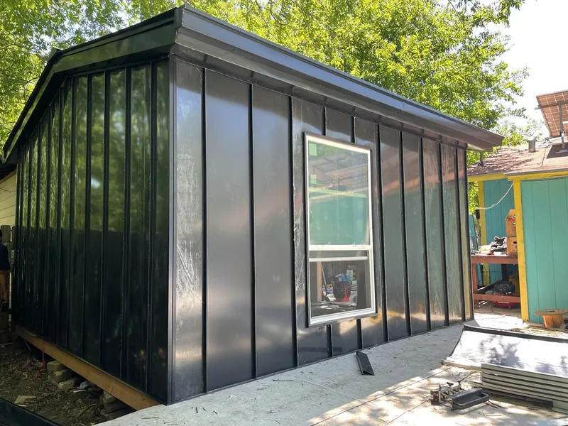 Black standing seam metal wall panels for Roof Inspection in Corning